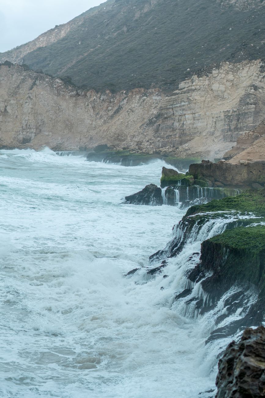 Dramatic coastal cliffs with ocean waves